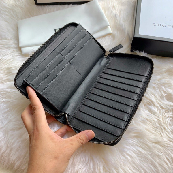 G*u*i leather zip around wallet