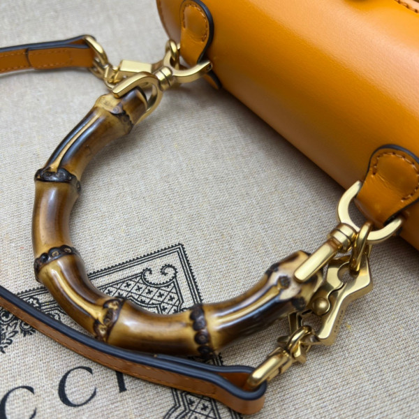 G*u*i mini top handle bag with bamboo